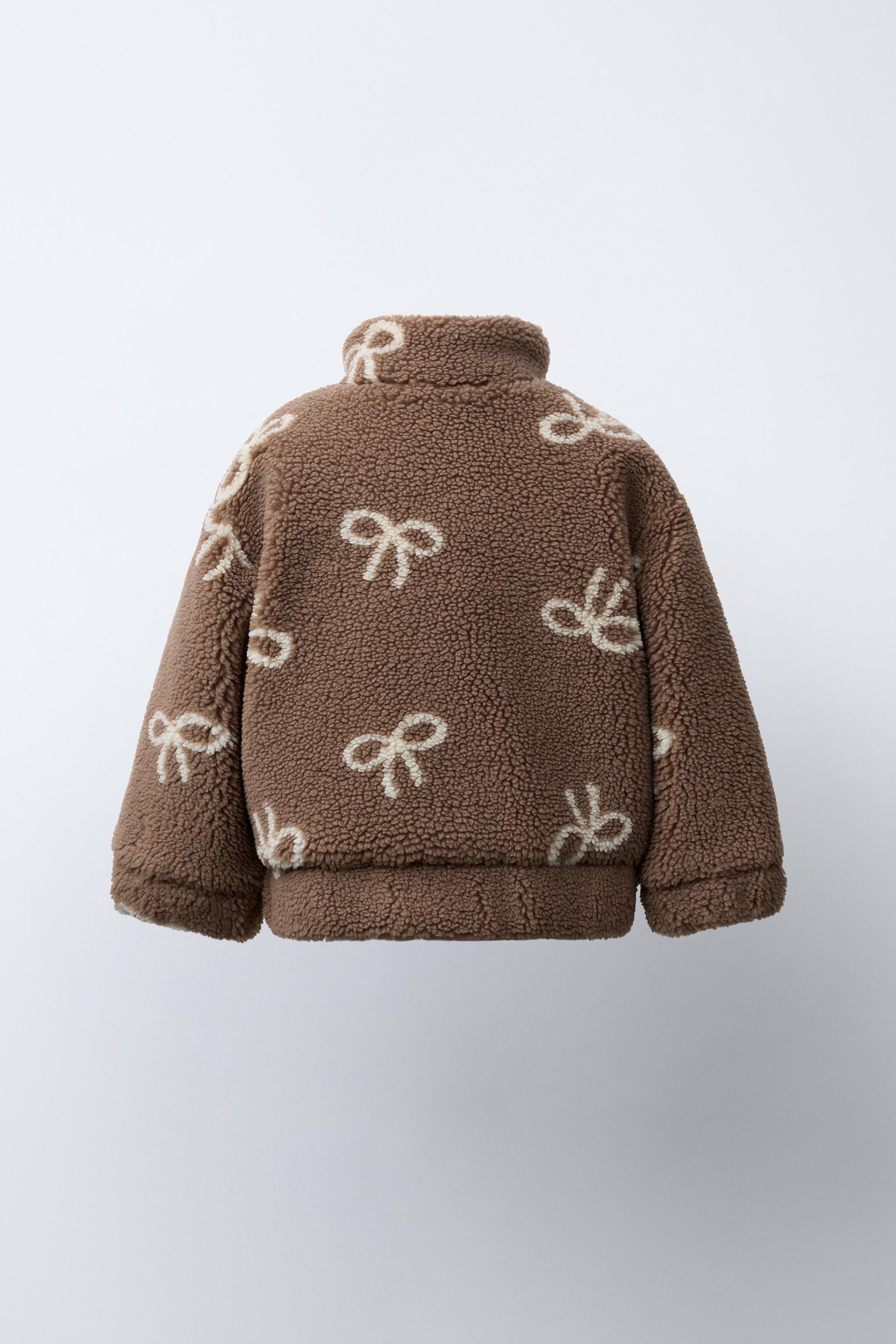 FAUX SHEARLING JACKET WITH BOW PRINT